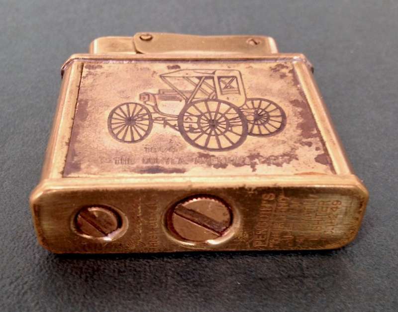 Vintage brass Penguin "Whirlwind" Lighter commemorating The Duryea - America's First, 1896.