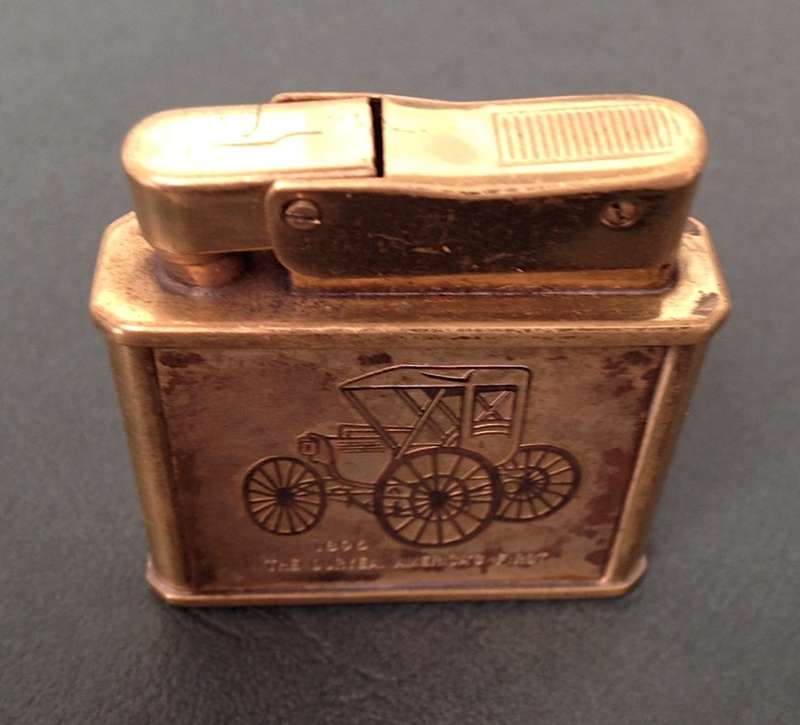 Vintage brass Penguin "Whirlwind" Lighter commemorating The Duryea - America's First, 1896.