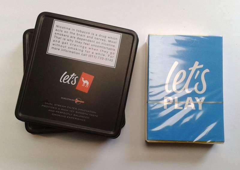 Camel cigarette tins and sealed playing cards (promotional items)