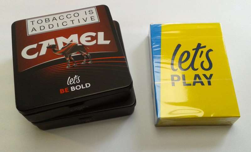 Camel cigarette tins and sealed playing cards (promotional items)