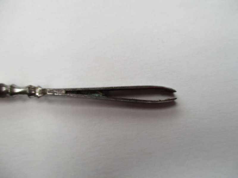 Antique, mother of pearl handled tweezers.
