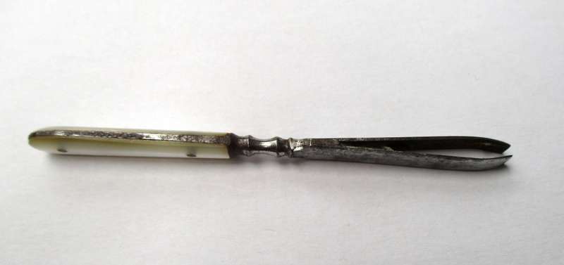 Antique, mother of pearl handled tweezers.