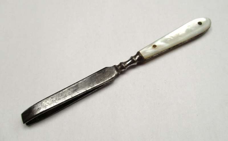 Antique, mother of pearl handled tweezers.