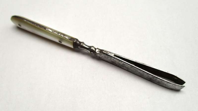 Antique, mother of pearl handled tweezers.