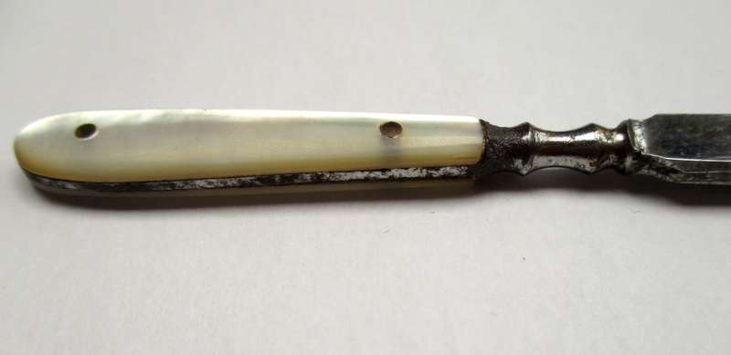 Antique, mother of pearl handled tweezers.