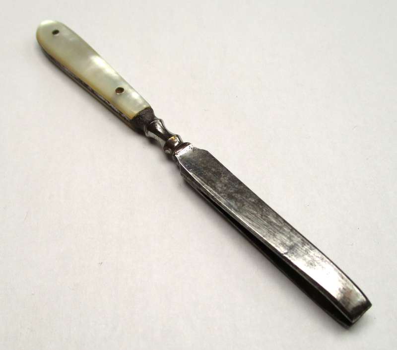 Antique, mother of pearl handled tweezers.