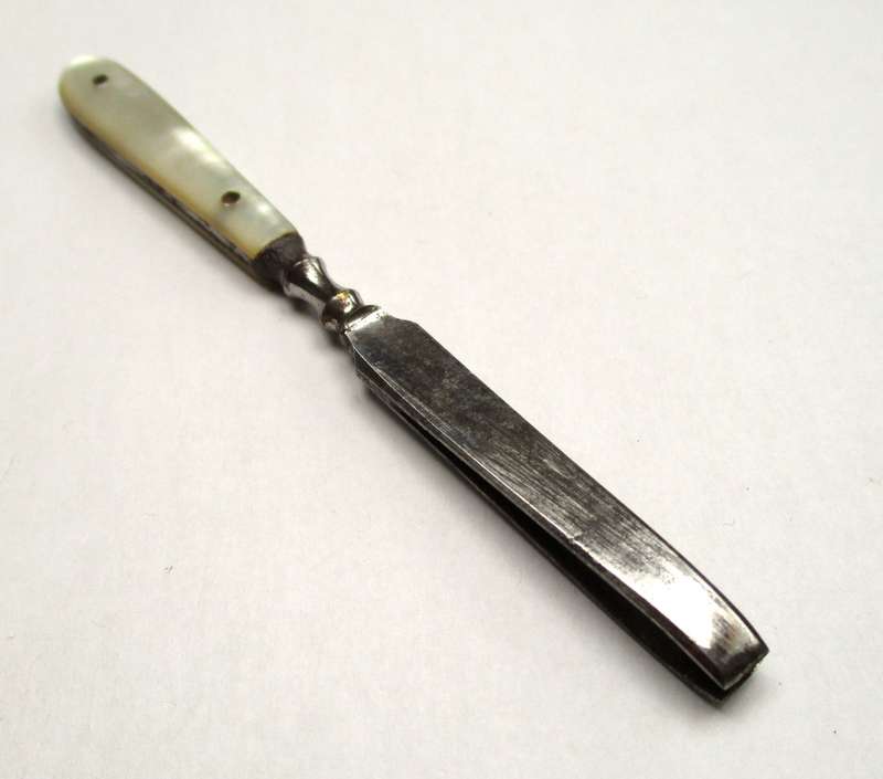 Antique, mother of pearl handled tweezers.