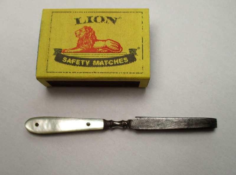 Antique, mother of pearl handled tweezers.