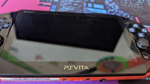 PS Vita Slim (2000) Red and Black with 3 games, 8GB Vita Memory card