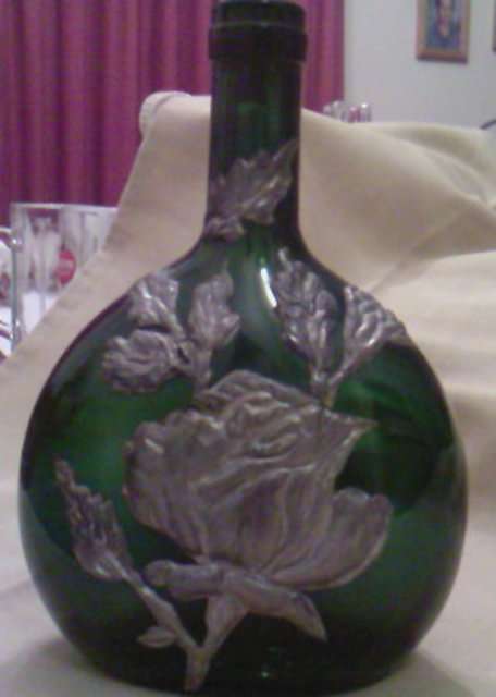 GREEN WINE BOTTLE WITH PEWTER DECORATIONS