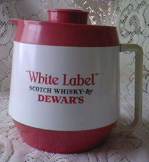 VINTAGE DEWARS PLASTIC WATER JUG WITH LID (MARCHING SCOTSMAN)