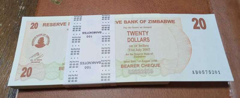 2006 Zimbabwe stack 100x Twenty Dollars bills in RBZ seal. Crisp UNC
