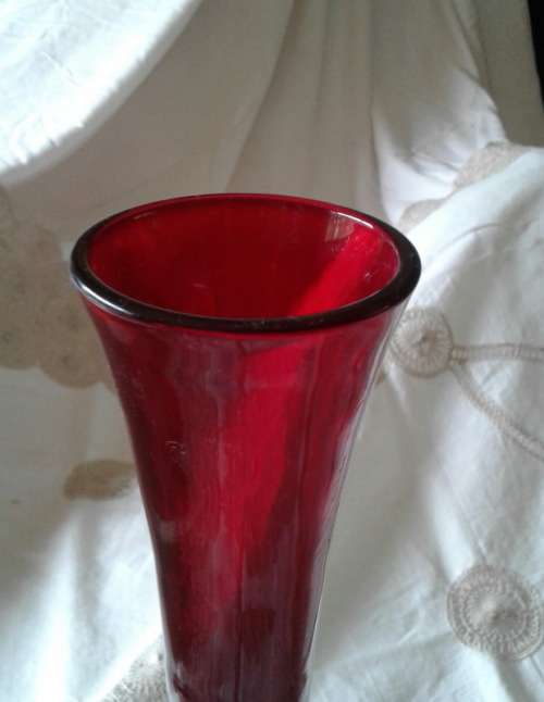 vintage ruby red vase with clear foot venetian?