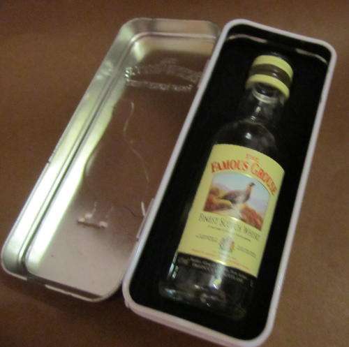 FAMOUS GROUSE TIN WITH EMPTY BOTTLE