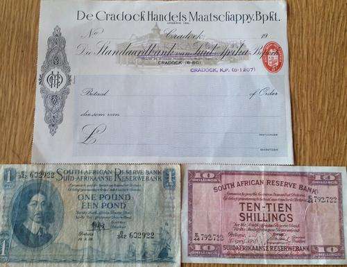 1X STANDAARDBANK CHEQUE- 1X ONE POUND NOTE- 1X TEN SHILLINGS NOTE