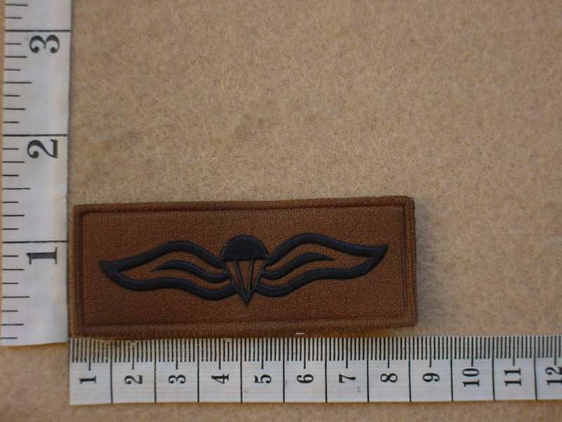 Para Wings.Rubberised black on nutria,both pins intact -- as new(never worn)