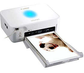 Canon Selphy CP530 with extra paper and cartridges