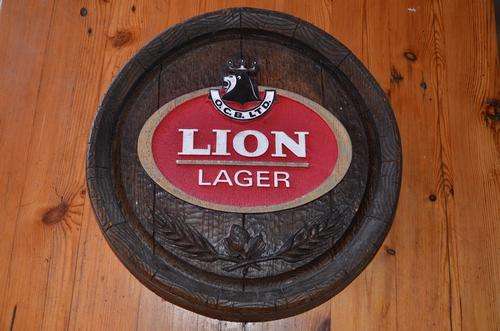 Large "barrel end" Lion Lager bar sign
