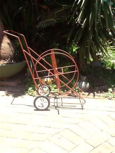 A Hosepipe Holder on Wheels.