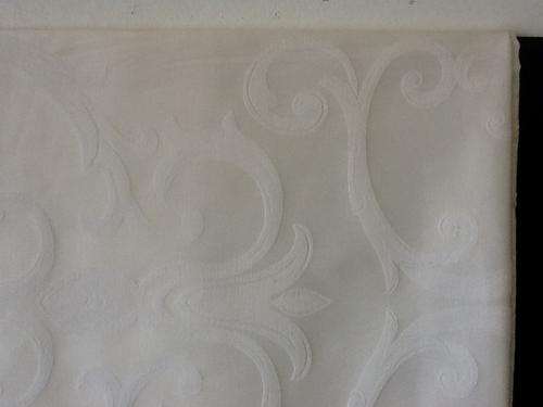 A Damask Tablecloth with a Roman Type Pattern.