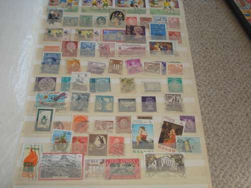 WORLD COLLECTION IN TWO STOCK BOOKS-ANYTHING COULD BE IN THESE !! READ BELOW