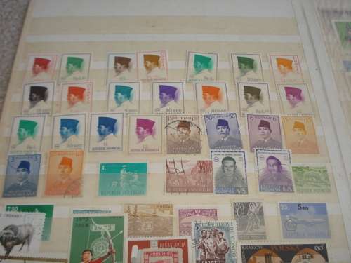 WORLD COLLECTION IN TWO STOCK BOOKS-ANYTHING COULD BE IN THESE !! READ BELOW