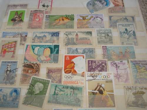 WORLD COLLECTION IN TWO STOCK BOOKS-ANYTHING COULD BE IN THESE !! READ BELOW