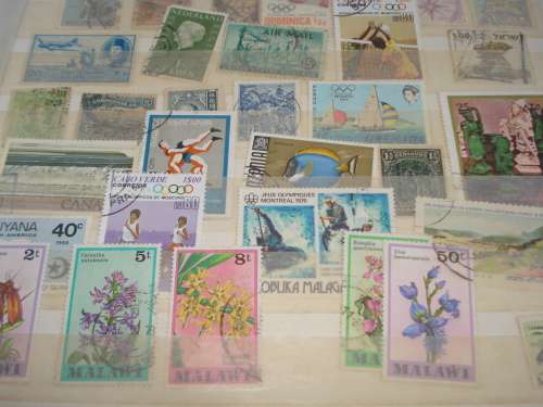 WORLD COLLECTION IN TWO STOCK BOOKS-ANYTHING COULD BE IN THESE !! READ BELOW