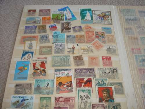WORLD COLLECTION IN TWO STOCK BOOKS-ANYTHING COULD BE IN THESE !! READ BELOW