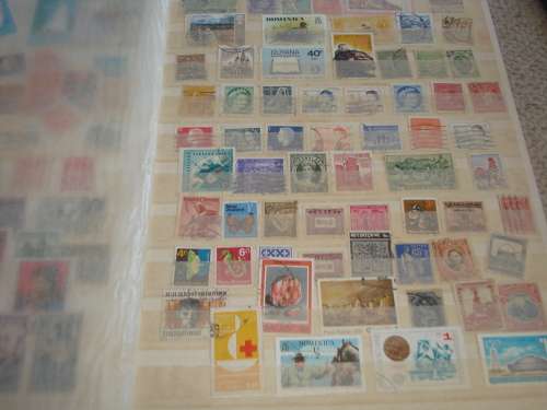 WORLD COLLECTION IN TWO STOCK BOOKS-ANYTHING COULD BE IN THESE !! READ BELOW