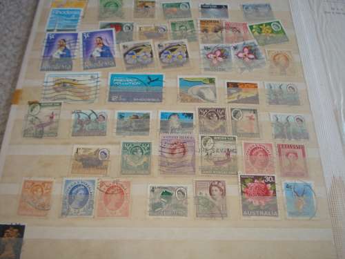WORLD COLLECTION IN TWO STOCK BOOKS-ANYTHING COULD BE IN THESE !! READ BELOW