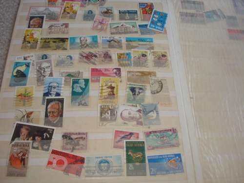 WORLD COLLECTION IN TWO STOCK BOOKS-ANYTHING COULD BE IN THESE !! READ BELOW
