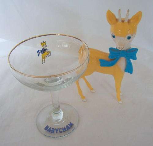 AN ADORABLE PAIR - A BABYCHAM GLASS AND BOKKIE
