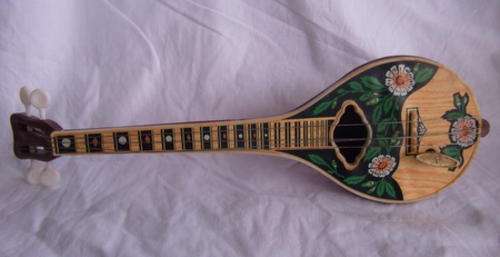 A LOVELY WIND UP MUSICAL BANJO