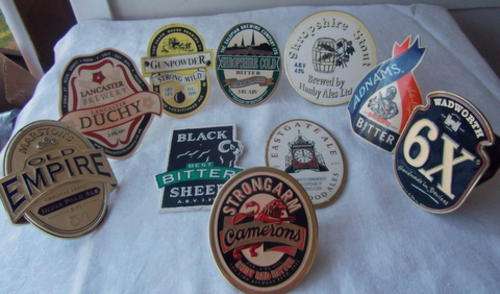 A STUNNING COLLECTION OF TEN BEER KEG LABELS