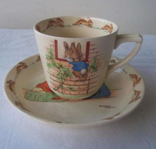 A LOVELY BUNNYKINS CUP AND SAUCER - ROYAL DOULTON - SIGNED BY BARBARA VERON