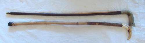 TWO OLD HANDMADE WALKING STICKS - WARTHOG TUSK AND COW HORN HANDLES