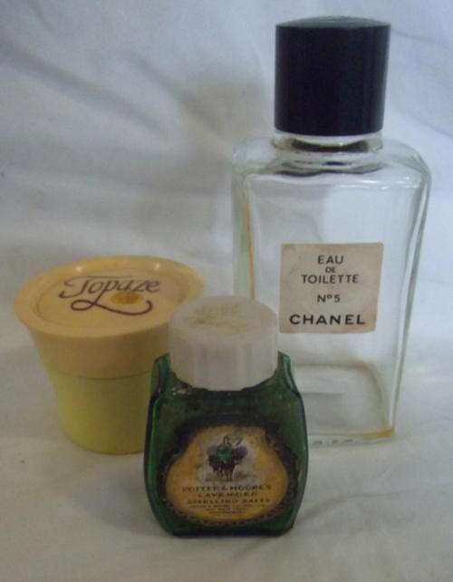 COLLECTION OF THREE PERFUME BOTTLES - WELL OK A BOTTLE A JAR AND A SMELLING SALTS BOTTLE WITH CONTEN