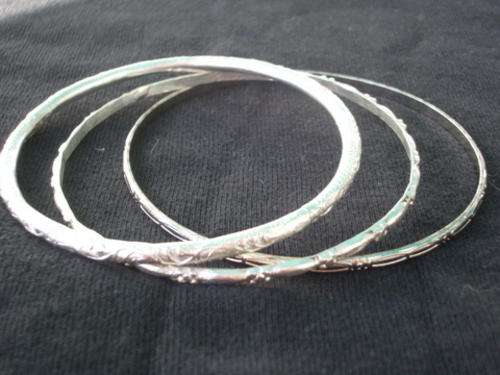 THREE LOVELY VINTAGE STERLING SILVER BANGLES