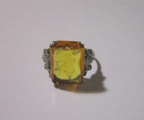 Lovely Antique Intaglio Citrine stone with a cupid set in sterling silver with marcasite detail.