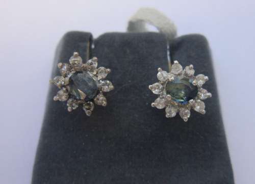 Lovely little tourmalines surrounded by white sapphires set in sterling silver studs.