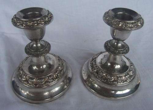 A PAIR OF ORNATE SILVERPLATED CANDLESTICKS - LOVELY BUT CAN DO WITH A REPLATE, OR ENJOY THEM IN A S