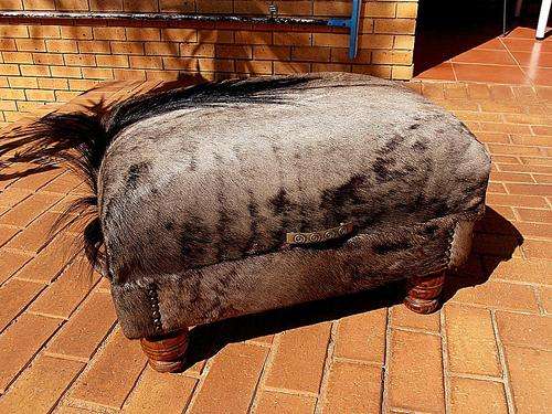 STORAGE OTTOMAN, WILDEBEEST FOOTSTOOL