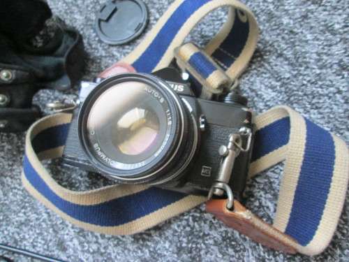 Olympus OM1 SLR, with enlarging rings, cable release, strap, and pouch.