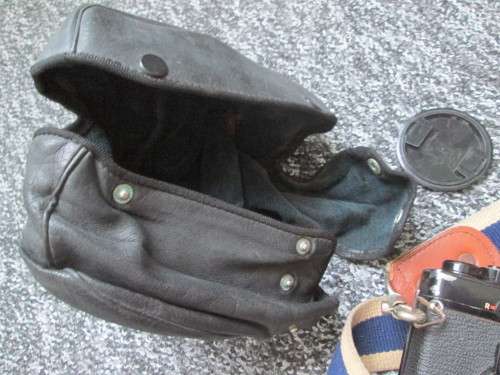Olympus OM1 SLR, with enlarging rings, cable release, strap, and pouch.