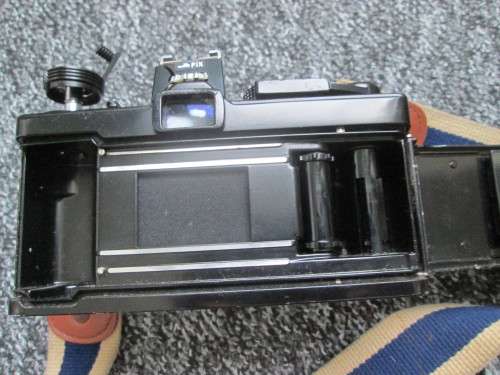 Olympus OM1 SLR, with enlarging rings, cable release, strap, and pouch.