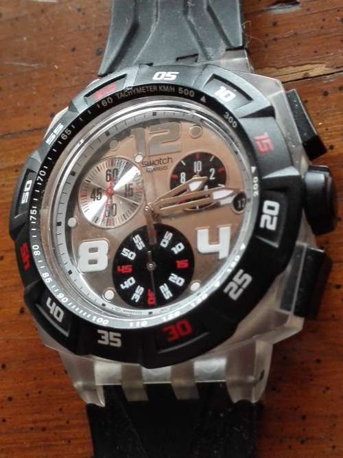 COLLECTORS SWATCH WATCH IN BOX WITH PAPERS