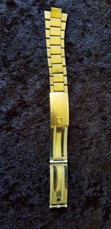 OMEGA BUCKLE AND ONE SIDE OF STRAP