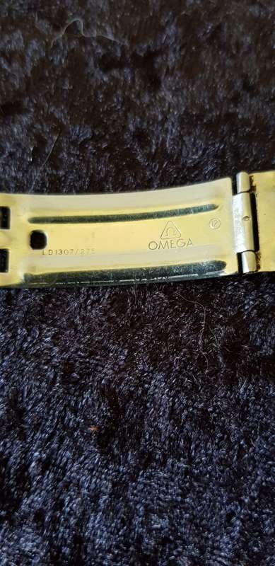 OMEGA BUCKLE AND ONE SIDE OF STRAP