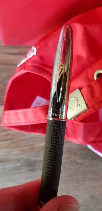 BRAND NEW GENUINE OMEGA CAP AND PEN IN GIFT BAG